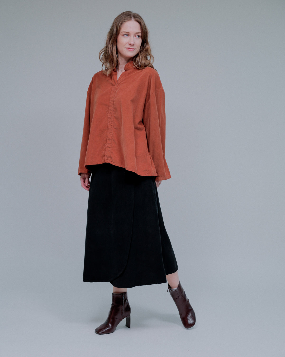 Center Trim Stand Collar Long Sleeve Top in Terra_Front
