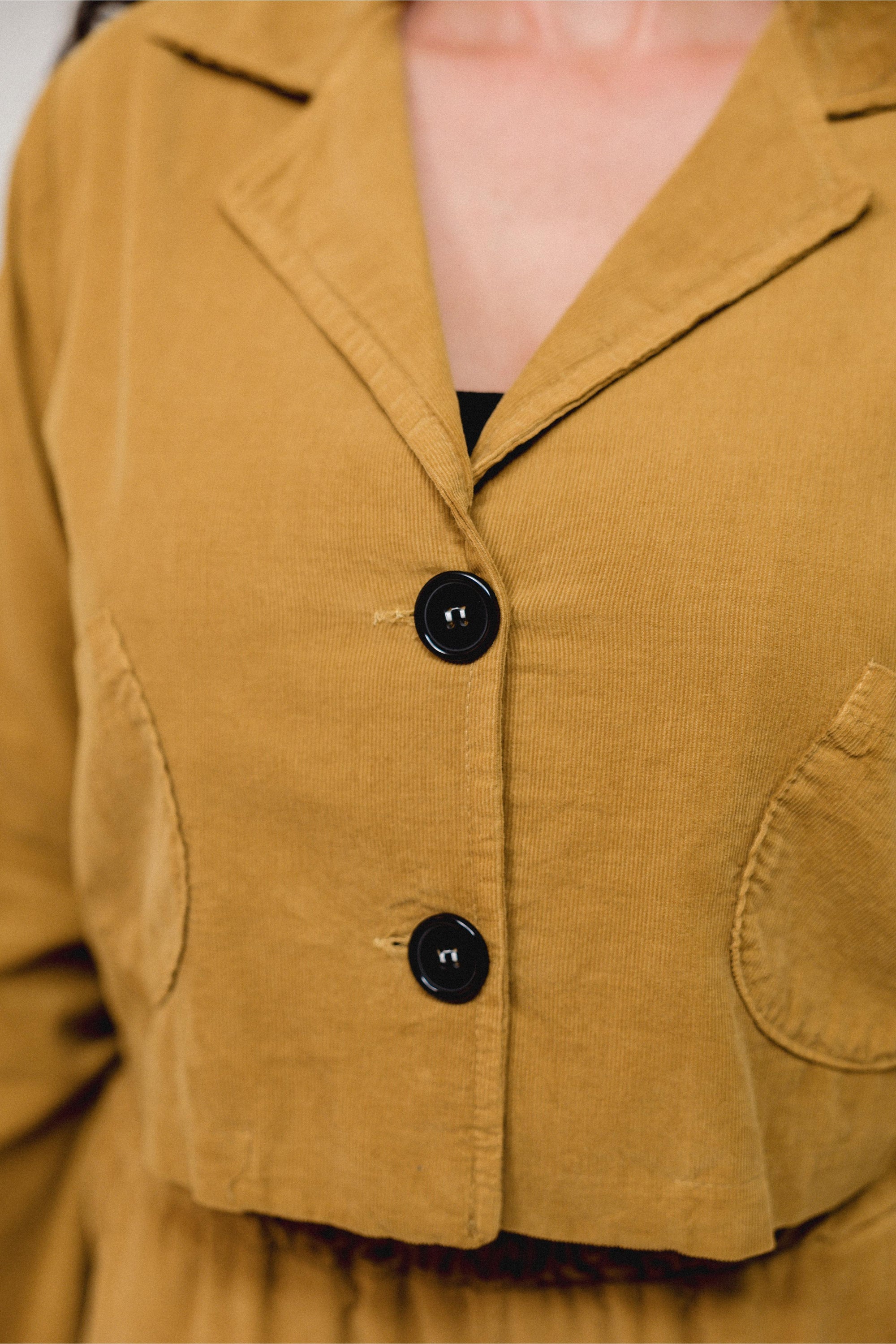 Collar Crop Cover Top in Mustard_Button Detail