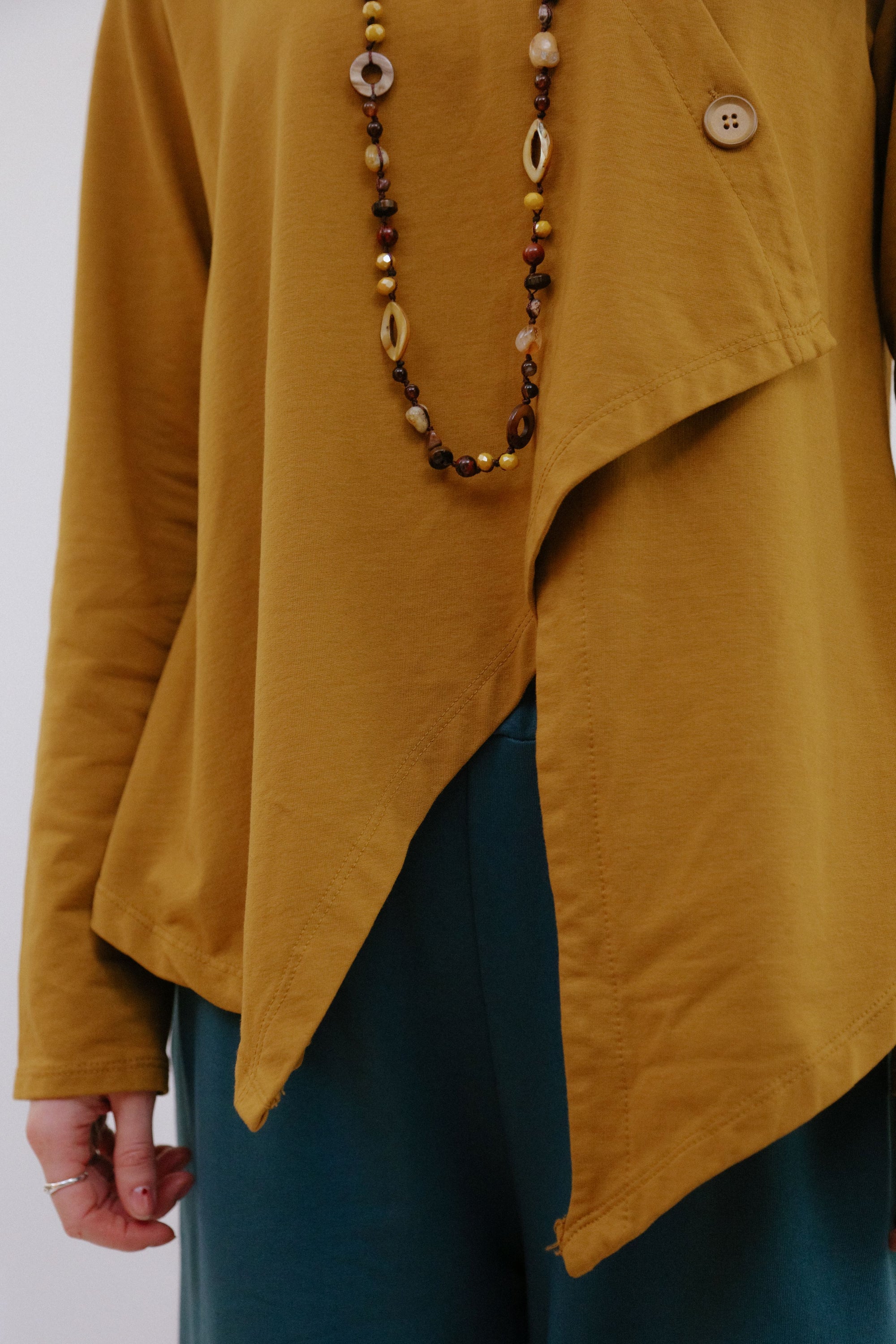 Mand Collar Assym Top in Camel_Hem Detail